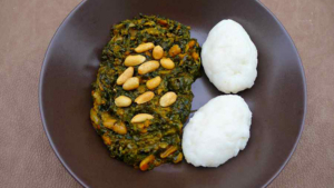 Nsima with pumpkin leaves, tomato, and ground nuts - Zambia, Africa