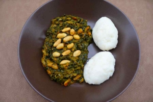 Nsima with pumpkin leaves, tomato, and ground nuts - Zambia, Africa