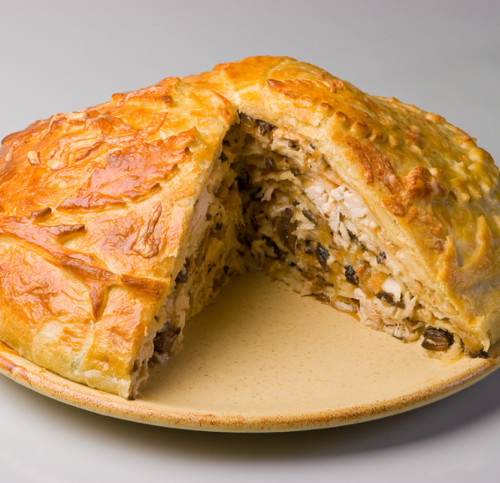 Festive Russian Kurnik sliced pie stuffed with chicken, potatoes and onions  close up on a slate board on the table. vertical top view above Stock Photo  - Alamy